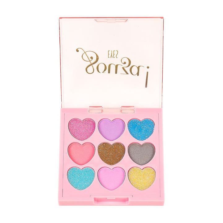 Geöffnete rosa Souza Elf Lidschattendose mit neun herzförmigen Farbfeldern.