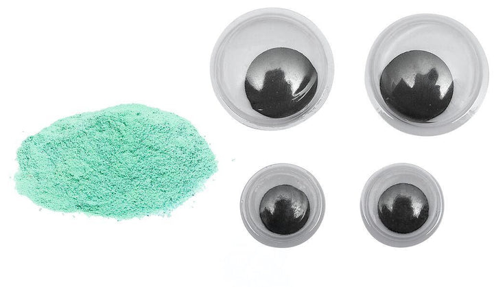 Groen poeder en vier wiebeloogjes uit de Moses PhänoMINT Glow-experimentenset.