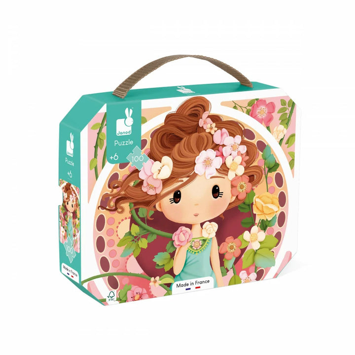 Janod Puzzle inspiriert von Mucha im Koffer mit Griff, mit einer Frau und Blumen auf der Vorderseite.