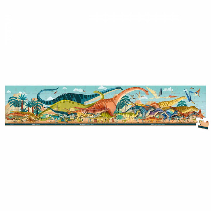 Janod Dino-Panoramapuzzle mit einem losen Eckteil neben der Dinosaurierlandschaft.