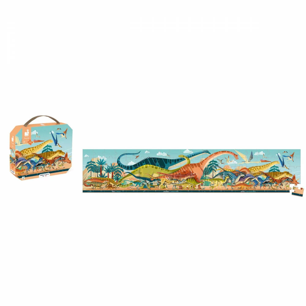 Janod Dino-Panoramapuzzle mit Aufbewahrungskoffer und losen Teilen neben dem Panorama.