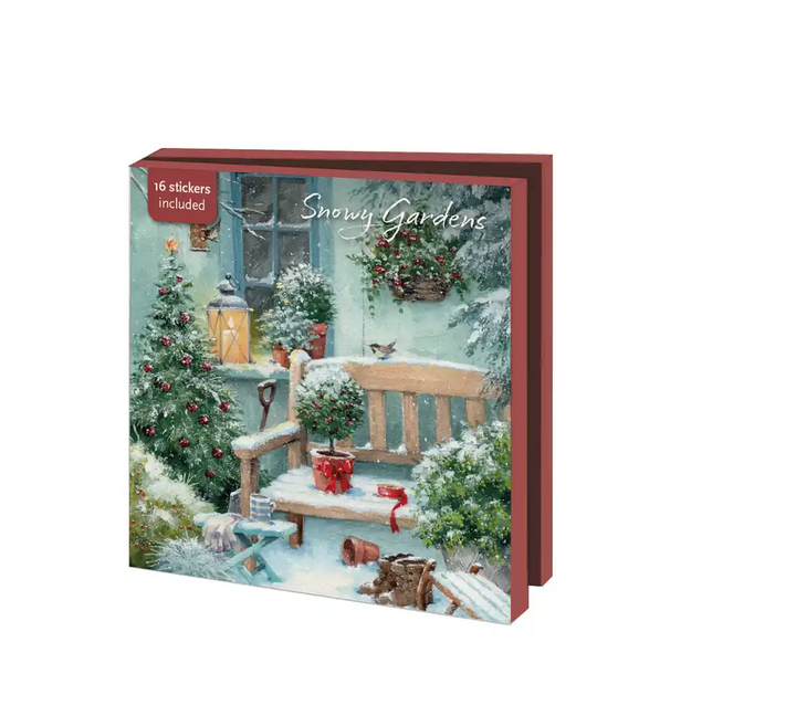 Een kaartenmapje toont besneeuwde tuinen met bankjes en kerstversiering.