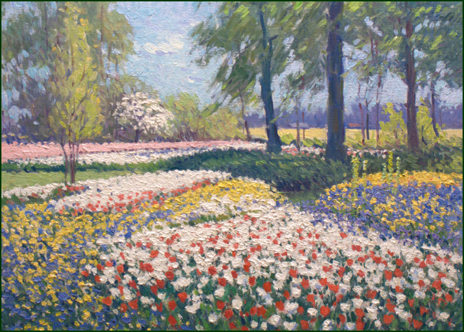 Des parterres fleuris de Keukenhof s’étendent entre des arbres et des allées.