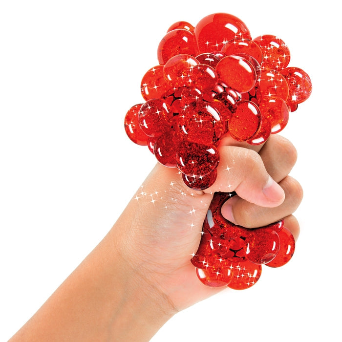 Clementoni – hand squeezing a red squishy ball