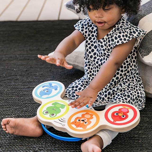 Baby Einstein Magic Touch Drums – child playing with the toy
