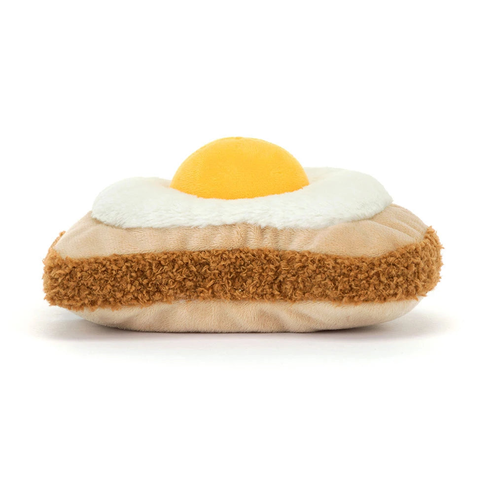 Jellycat Egglantine Egg On Toast von hinten mit brauner Brotkruste und gelbem Eigelb