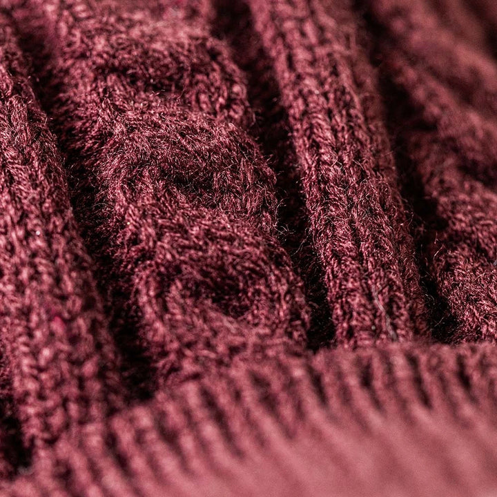 Detail of the white fur and dark red knitted jumper of Jellycat Munro Scottie Dog