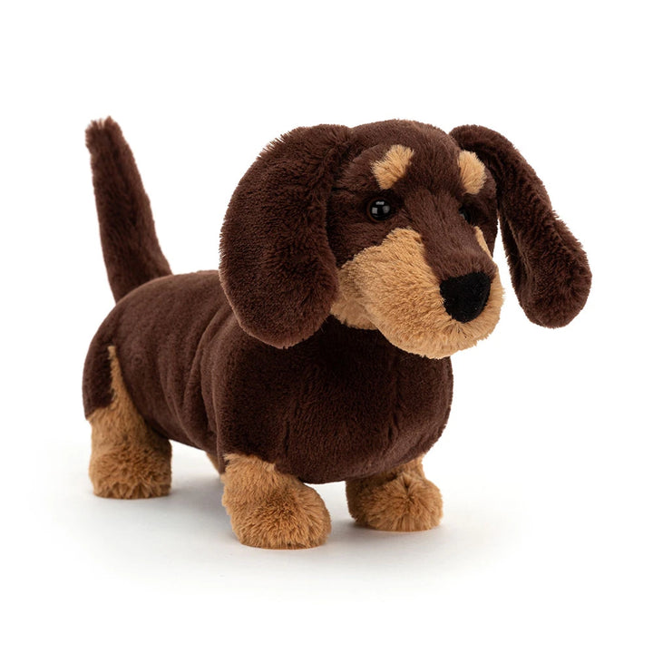 Jellycat Otto Sausage Dog Medium from a front angle, with floppy ears, a light muzzle and short legs
