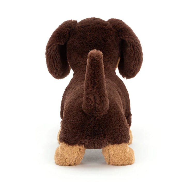 Rear view of Jellycat Otto Sausage Dog Medium with floppy ears and an upright tail