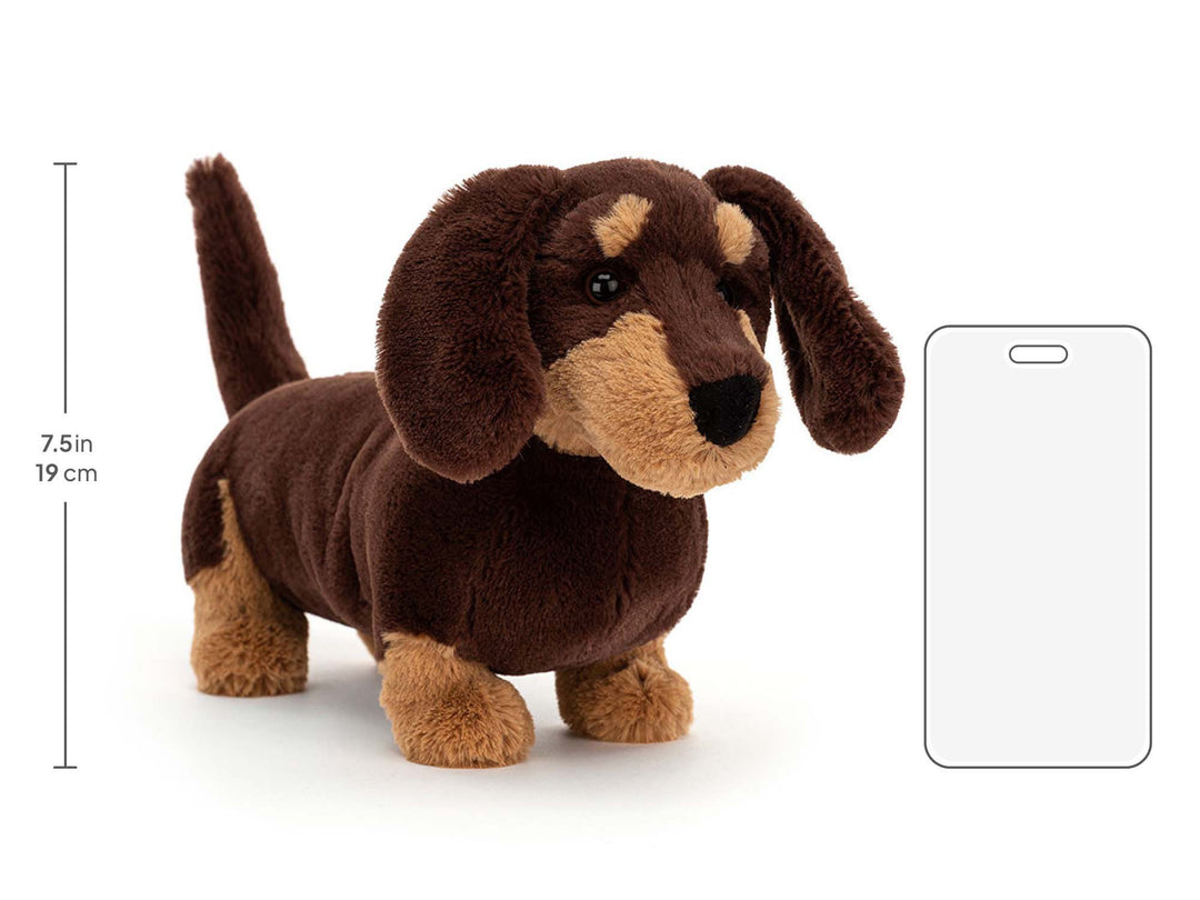 Jellycat Otto Sausage Dog Medium beside a phone outline, showing a height of 19 cm