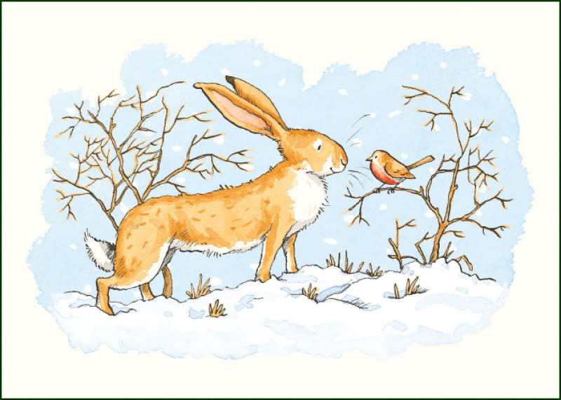 A hare leaps through a wintry landscape with bare branches.