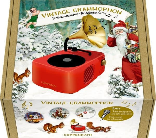 Rode vintage grammofoon met gouden hoorn en kerstplaatjes